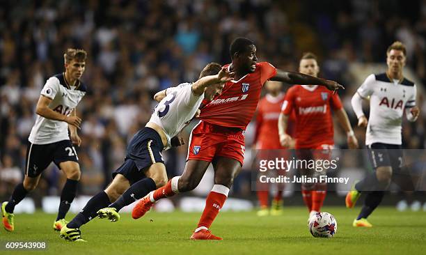 Jay Emmanuel-Thomas of Gillingham and Ben Davies of Tottenham Hotspur in action during the EFL Cup Third Round match between Tottenham Hotspur and...
