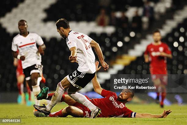 Aaron Wilbraham of Bristol City slides in to tackle Michael Madl of Fulham during the EFL Cup Third Round match between Fulham and Bristol City at...