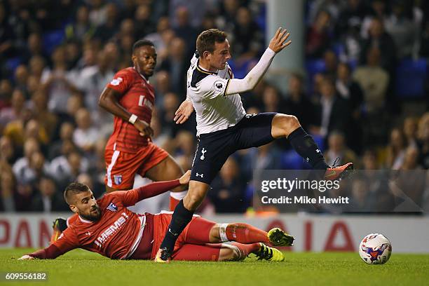 Vincent Janssen of Tottenham Hotspur and Max Ehmer of Gillingham in action during the EFL Cup Third Round match between Tottenham Hotspur and...