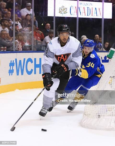 Seth Jones of Team North America stickhandles the puck with Carl Soderberg of Team Sweden chasing during the World Cup of Hockey 2016 at Air Canada...