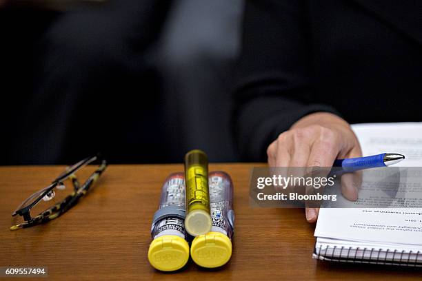 Mylan NV EpiPen medication sits on a witness table next to Heather Bresch, chief executive officer of Mylan, during a House Oversight and Government...