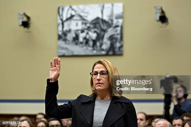 Heather Bresch, chief executive officer of Mylan NV, swears in to a House Oversight and Government Reform Committee hearing in Washington, D.C.,...