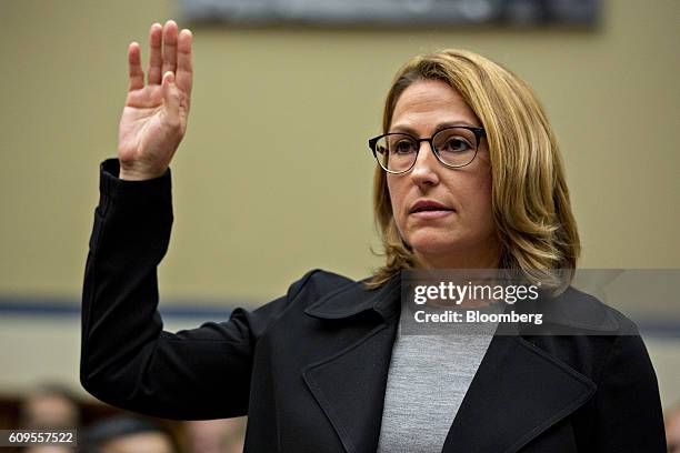 Heather Bresch, chief executive officer of Mylan NV, swears in to a House Oversight and Government Reform Committee hearing in Washington, D.C.,...