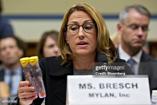 Heather Bresch, chief executive officer of Mylan NV, holds up Mylan EpiPen medication while speaking during a House Oversight and Government Reform...