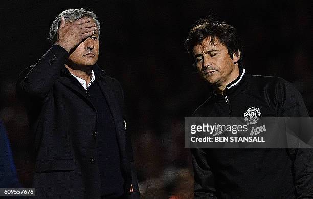 Manchester United's Portuguese manager Jose Mourinho and Manchester United's Portuguese assistant manager Rui Faria react during the English League...