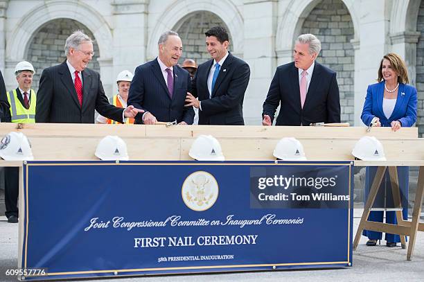 Speaker Paul Ryan, R-Wis., center, reacts to the technique of Sen. Charles Schumer, D-N.Y., as Senate Majority Leader Mitch McConnell, R-Ky., far...