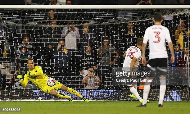 Ivan Lucic of Bristol City saves a penalty from Cauley Woodrow of Fulham during the EFL Cup Third Round match between Fulham and Bristol City at...