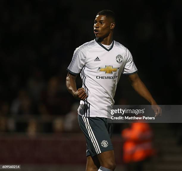 Marcus Rashford of Manchester United celebrates scoring his team's third goal during the EFL Cup Third Round match between Northampton Town and...