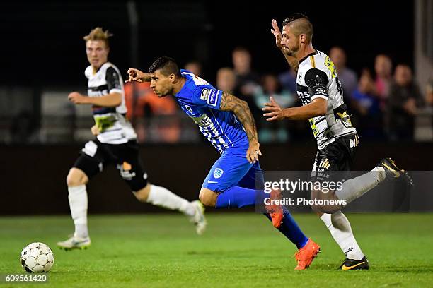 Nikolaos Karelis forward of KRC Genk is challenged by Kenny Van Hoevelen defender of SC Eendracht Aalst during the Croky Cup 1/16 final match between...