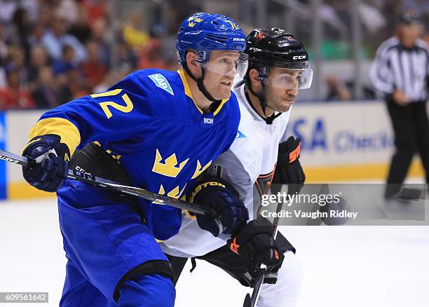 Patric Hornqvist of Team Sweden battles for position with Vincent Trocheck of Team North America during the World Cup of Hockey 2016 at Air Canada...