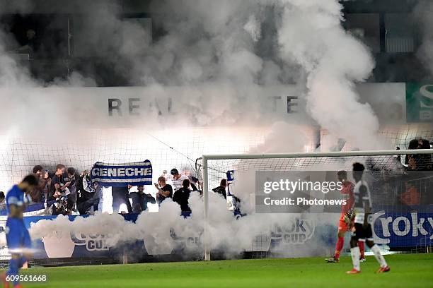 Supporters of KRC Genk are covered in smoke during the Croky Cup 1/16 final match between SC Eendracht Aalst and KRC Genk in the Pierre Cornelis...