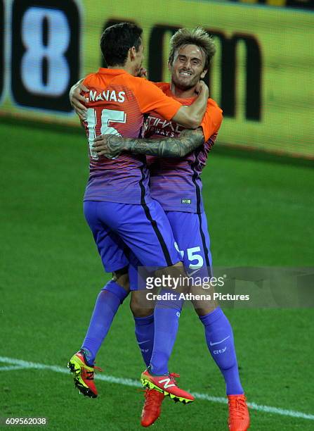 Aleix Garcia of Manchester City celebrates his goal with team mate Jesus Navas during the EFL Cup Third Round match between Swansea City and...