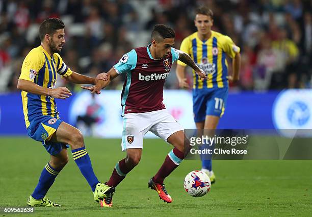 Manuel Lanzini of West Ham United holds off Seamus Conneely of Accrington Stanley during the EFL Cup Third Round match between West Ham United and...