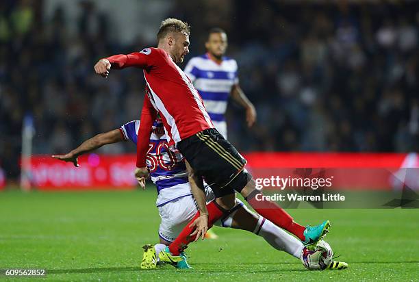 Jan Kirchhoff of Sunderland and Sandro of QPR in action during the EFL Cup Third Round match between Queens Park Rangers and Sunderland at Loftus...