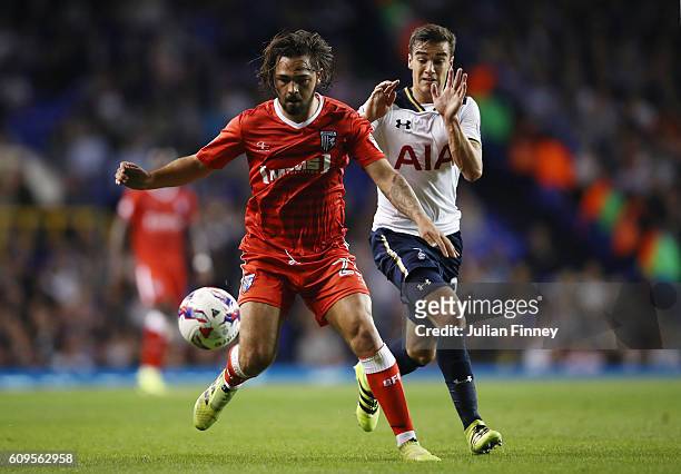 Bradley Dack of Gillingham and Harry Winks of Tottenham Hotspur in action during the EFL Cup Third Round match between Tottenham Hotspur and...