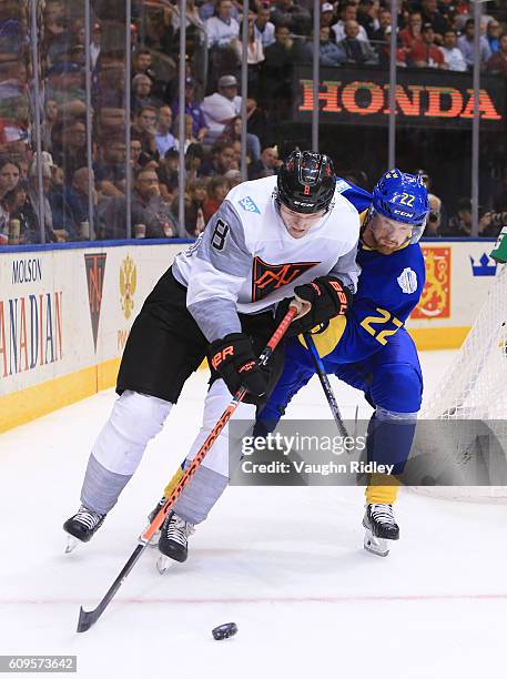 Jacob Trouba of Team North America battles for the puck with Daniel Sedin of Team Sweden during the World Cup of Hockey 2016 at Air Canada Centre on...