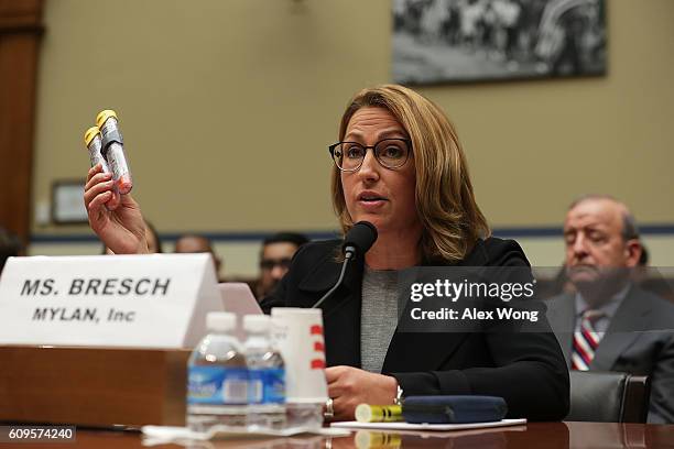 Mylan Inc. CEO Heather Bresch holds up a 2-pack of EpiPen as she testifies during a hearing before the House Oversight and Government Reform...