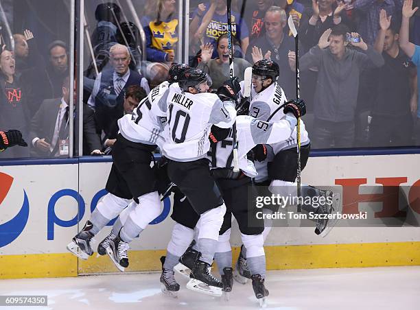 Nathan MacKinnon of Team North America celebrates his game-winning goal with teammates in overtime against Team Sweden during the World Cup of Hockey...