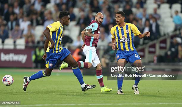 West Ham United's Simone Zaza gets in between Omar Beckles and Accrington Stanley's Zak Vyner during the EFL Cup Third Round match between West Ham...