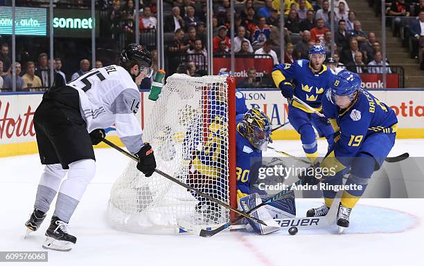 Jack Eichel of Team North America tries to get the puck past Henrik Lundqvist with Nicklas Backstrom of Team Sweden in front during the World Cup of...