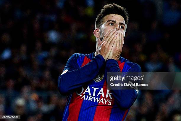 Gerard Pique of FC Barcelona reacts after missing a chance to score during the La Liga match between FC Barcelona and Club Atletico de Madrid at the...