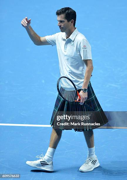Tim Henman of England wearing a Kilt during the doubles match between Andy Murray and Jamie Murray of Scotland and Tim Henman of England and Grigor...