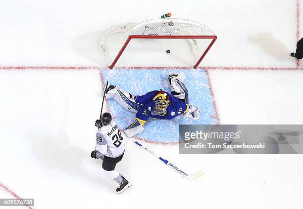 Nathan MacKinnon of Team North America scores the game-winning goal in overtime past Henrik Lundqvist of Team Sweden during the World Cup of Hockey...