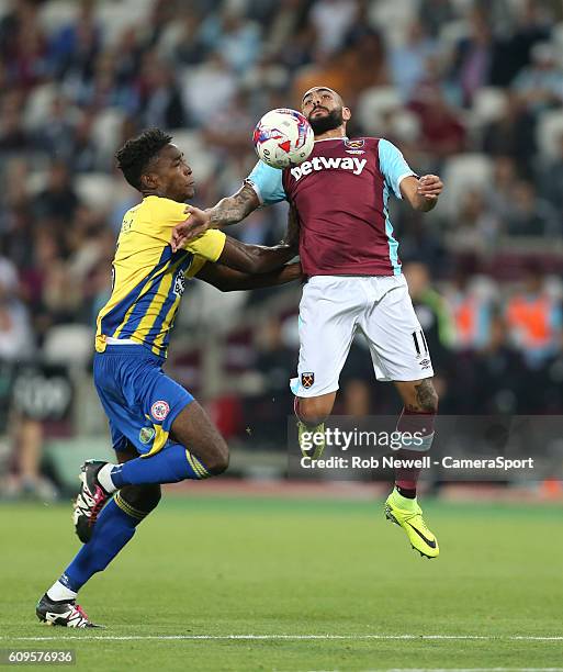 West Ham United's Simone Zaza and Accrington Stanley's Omar Beckles during the EFL Cup Third Round match between West Ham United and Accrington...