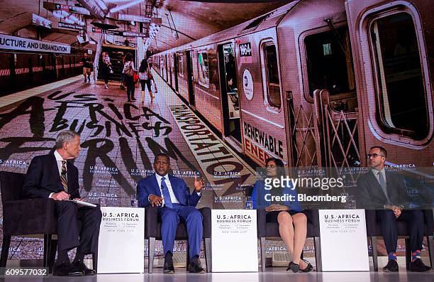 Aliko Dangote, president and chief executive officer of Dangote Sugar Refinery Plc, from second left, Jasandra Nyker, chief executive officer of...