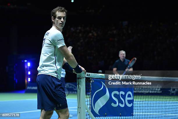 Andy Murray of Scotland takes a breather during the doubles match between Andy Murray and Jamie Murray of Scotland and Tim Henman of England and...