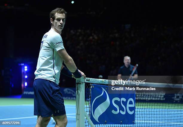 Andy Murray of Scotland takes a breather during the doubles match between Andy Murray and Jamie Murray of Scotland and Tim Henman of England and...