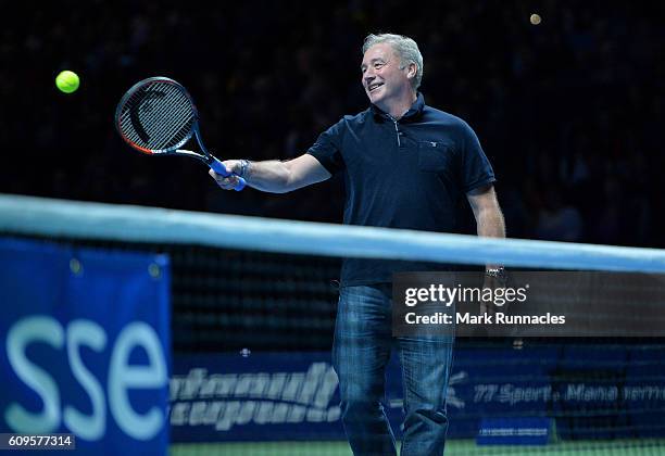 Ex Scottish football player Ally McCoist replaces Andy Murray of Scotland during the doubles match between Andy Murray and Jamie Murray of Scotland...
