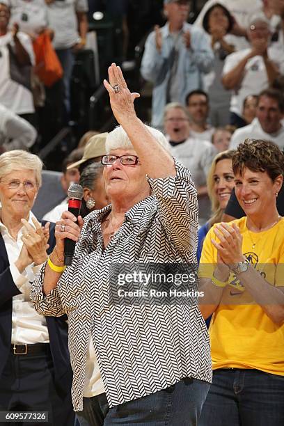 Former Fever coach Lin Dunn honors Tamika Catchings of the Indiana Fever during a ceremony after the game against the Dallas Wings at Bankers Life...