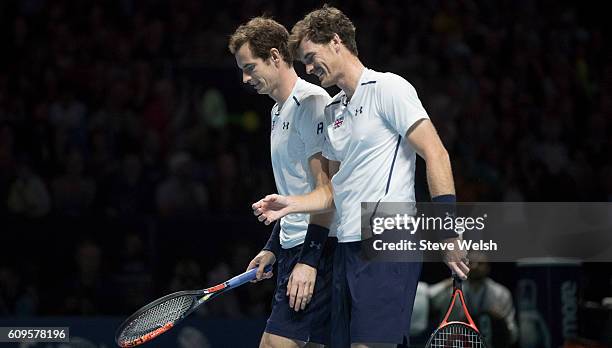 Andy Murray and Jamie Murray in doubles action against Grigor Dimitrov and Tim Henman during Andy Murray Live presented by SSE at the SSE Hydro on...