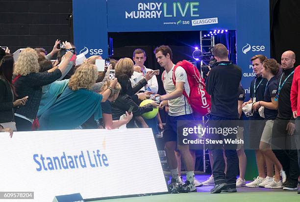Andy Murray signs autographs at the end of the evening during the Andy Murray Live presented by SSE at the SSE Hydro on September 21, 2016 in...