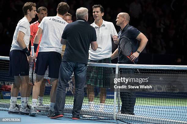 Ally McCoist and Tim Henman at the end of their doubles match during Andy Murray Live presented by SSE at the SSE Hydro on September 21, 2016 in...