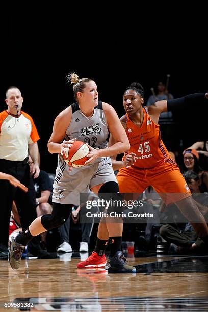 Jayne Appel-Marinelli of the San Antonio Stars handles the ball against Kelsey Bone of the Phoenix Mercury against the Phoenix Mercury at the AT&T...