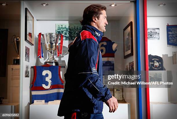 Coach Luke Beveridge walks past the Bulldogs 1954 premiership cup after speaking to the media during a Western Bulldogs AFL press conference at...