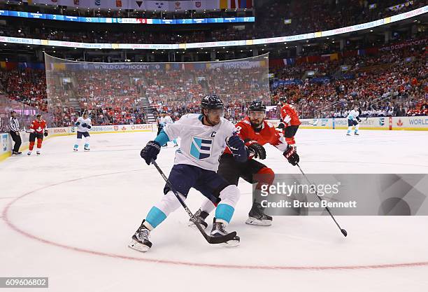 Anze Kopitar of Team Europe attempts to get around Drew Doughty of Team Canada during the first period at the World Cup of Hockey tournament at the...