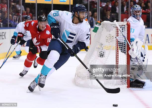 Pierre-Edouard Bellemare of Team Europe stickhandles the puck with Jonathan Toews of Team Canada chasing during the World Cup of Hockey 2016 at Air...