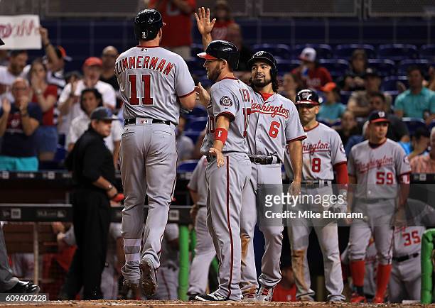 Ryan Zimmerman of the Washington Nationals is congratulated after hitting a three run home run during a game against the Miami Marlins at Marlins...