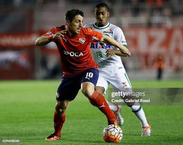 Cristian Rodriguez of Independiente fights for the ball with Matheus Biteco of Chapecoense during a first leg match between Independiente and...