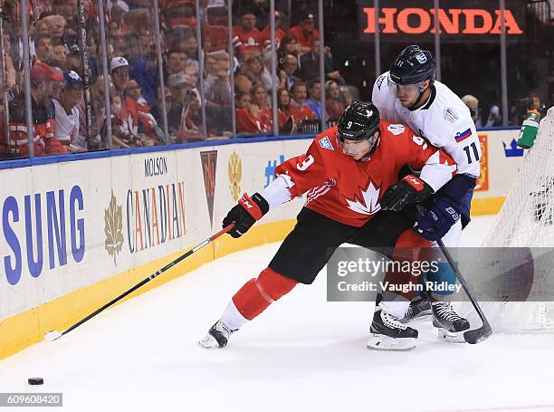 Matt Duchene of Team Canada pulls the puck away from Anze Kopitar of Team Europe during the World Cup of Hockey 2016 at Air Canada Centre on...