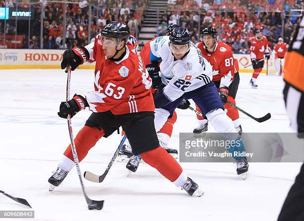 Brad Marchand fires a slapshot with pressure from Nino Niederreiter of Team Europe during the World Cup of Hockey 2016 at Air Canada Centre on...