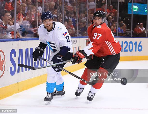 Andrej Sekera of Team Europe and Sidney Crosby of Team Canada chase down a loose puck during the World Cup of Hockey 2016 at Air Canada Centre on...