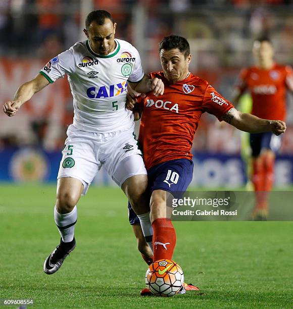 Cristian Rodriguez of Independiente fights for the ball with Josimar of Chapecoense during a first leg match between Independiente and Chapecoense as...