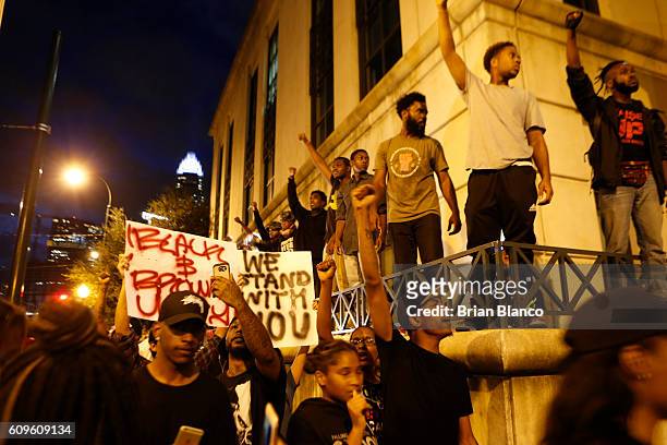 Protestors surround the Charlotte Police department as residents and activists protest the death of Keith Scott September 21, 2016 in Charlotte,...