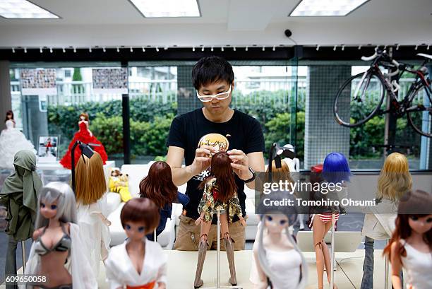 Danny Choo checks a smart doll at the Mirai Store Tokyo on August 22, 2016 in Tokyo, Japan. Isetan Mitsukoshi Holdings Ltd. Re-opens ISETAN The Japan...