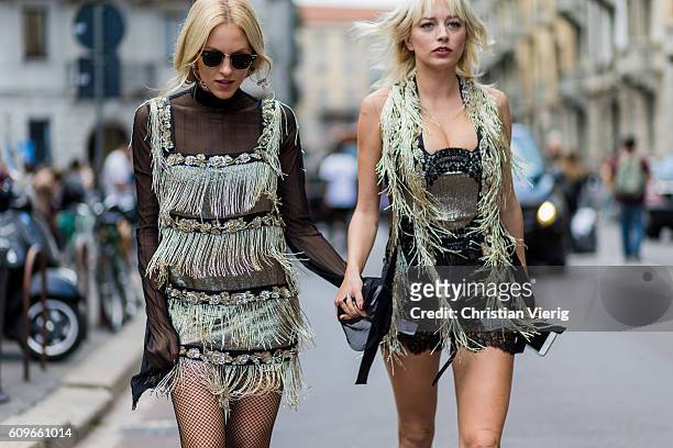 Shea Marie and Caroline Vreeland wearing dress with fringes is seen outside Alberta Ferretti during Milan Fashion Week Spring/Summer 2017 on...