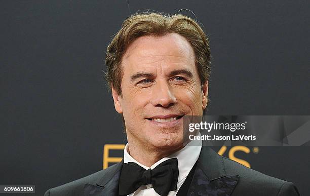 Producer John Travolta poses in the press room at the 68th annual Primetime Emmy Awards at Microsoft Theater on September 18, 2016 in Los Angeles,...